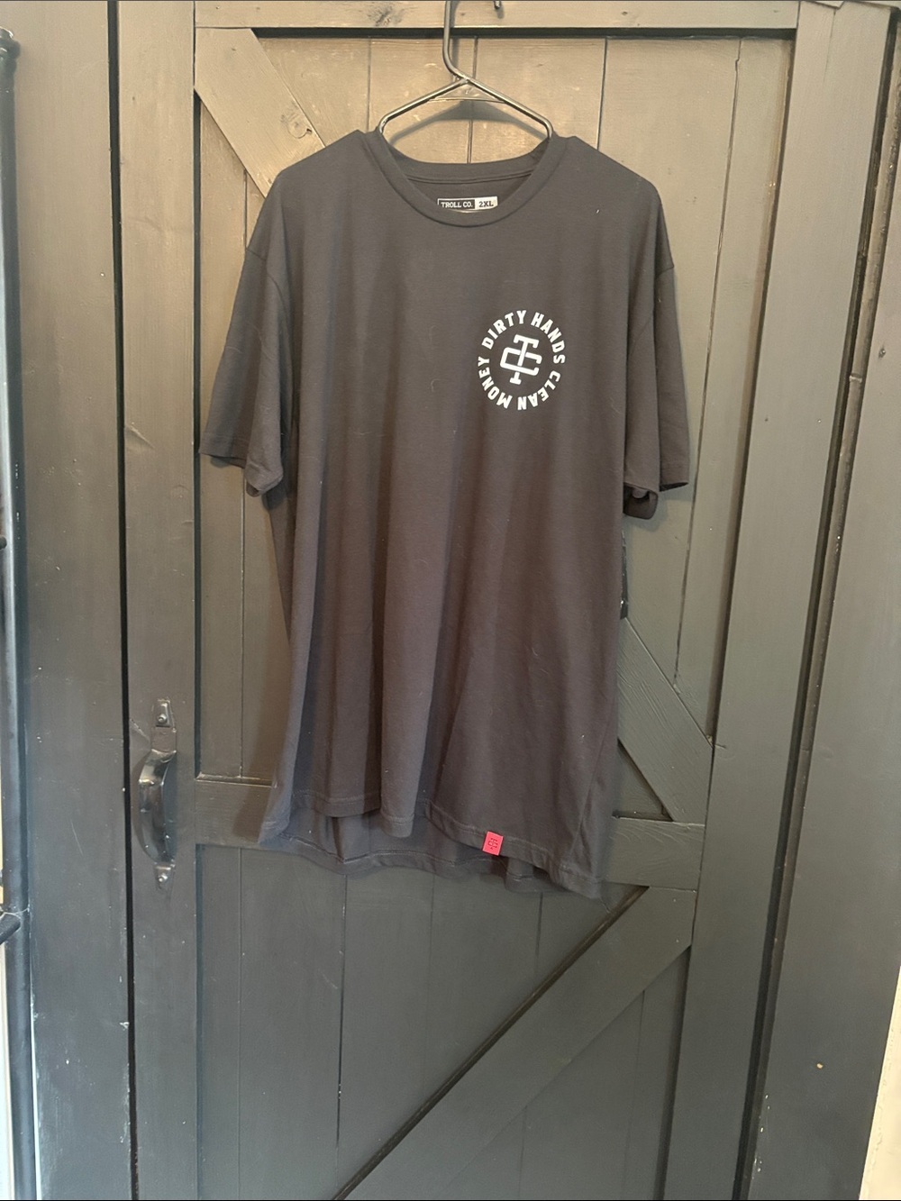 Trolls Black Tee with White Circular Chest Logo